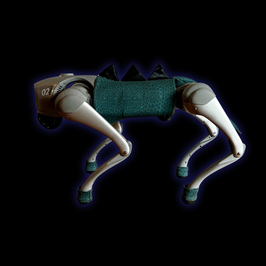 Arf the robot dog wearing a dinosaur costume — EverBot's teaching tool